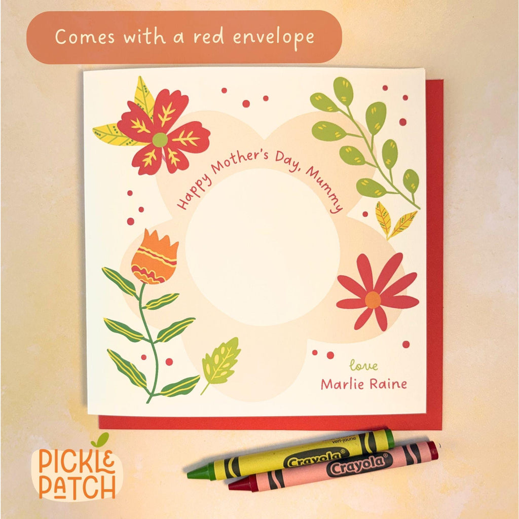 Greeting card with floral design and Crayola crayons on a beige background